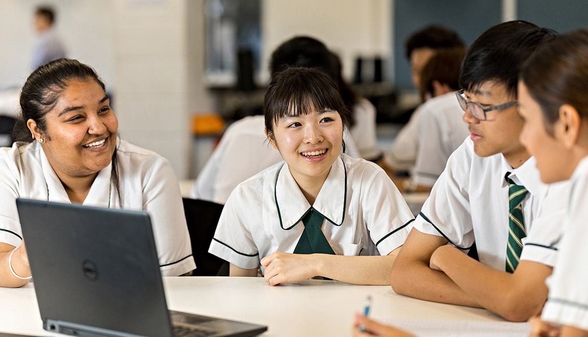 Photo of high school students having a discussion